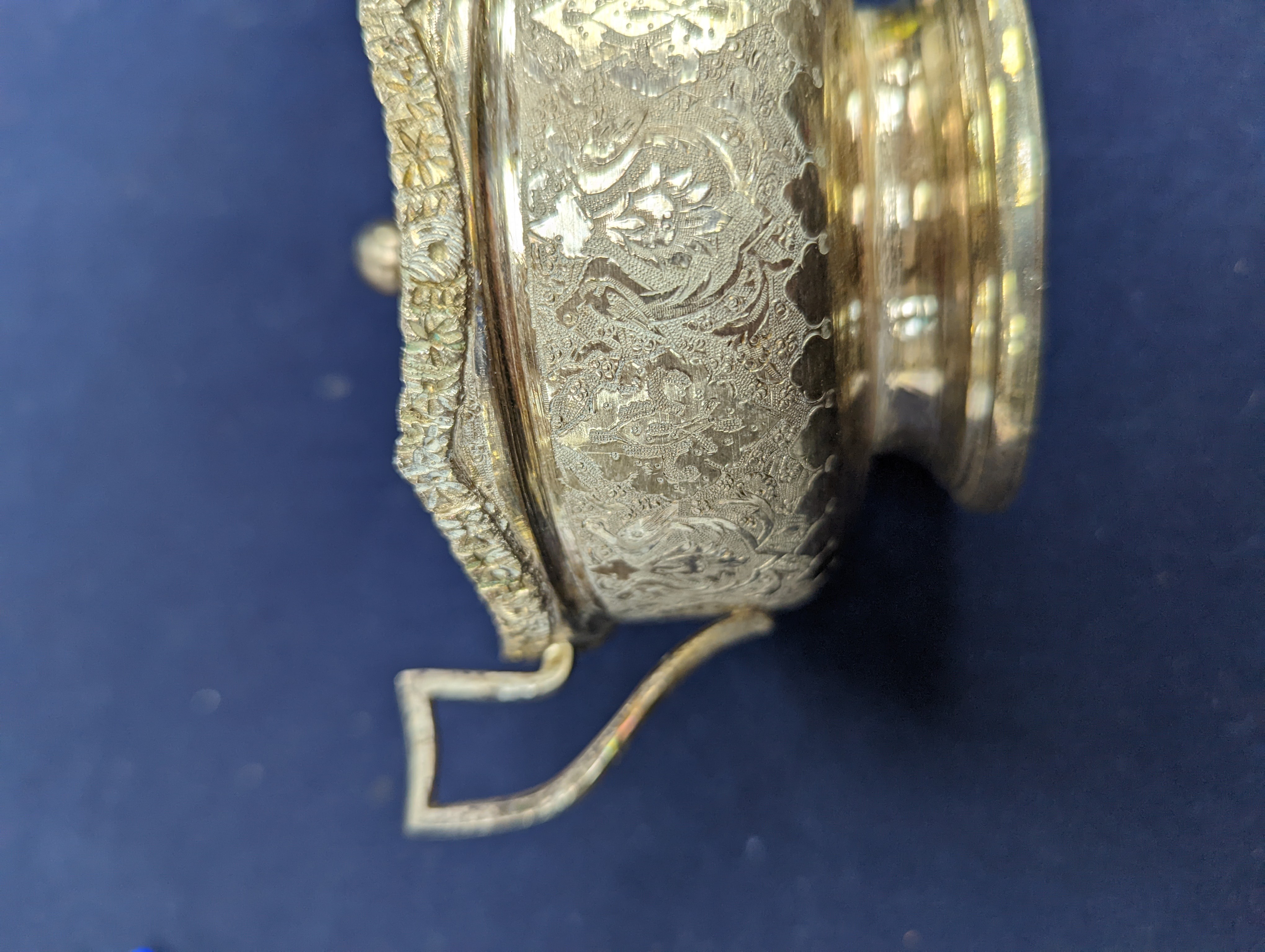 A set of six Persian embossed 84 standard white metal coffee cup holders and matching sugar bowl and cover by Vartan and four other Persian white metal items.